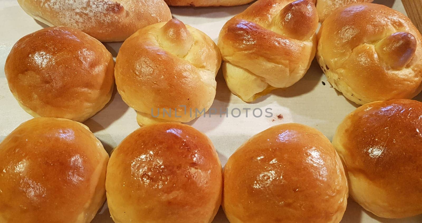 Fresh Baked soft bread rolls and hard bread rolls. Warm Fresh Buttery Rolls. good for your multimedia content background and restaurant menu