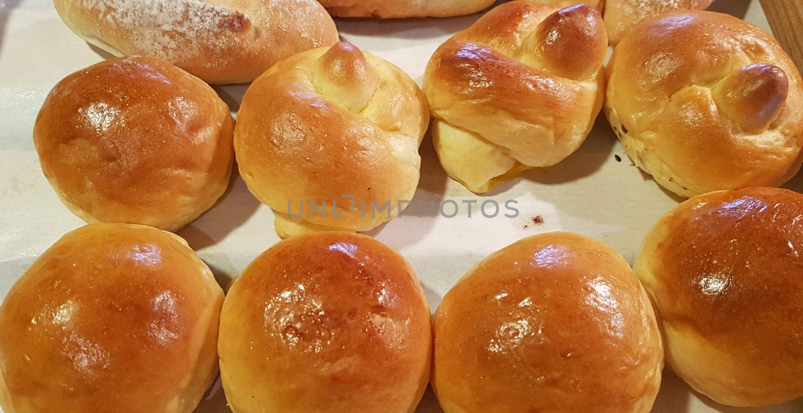 Fresh Baked soft bread rolls and hard bread rolls. Warm Fresh Buttery Rolls. good for your multimedia content background and restaurant menu