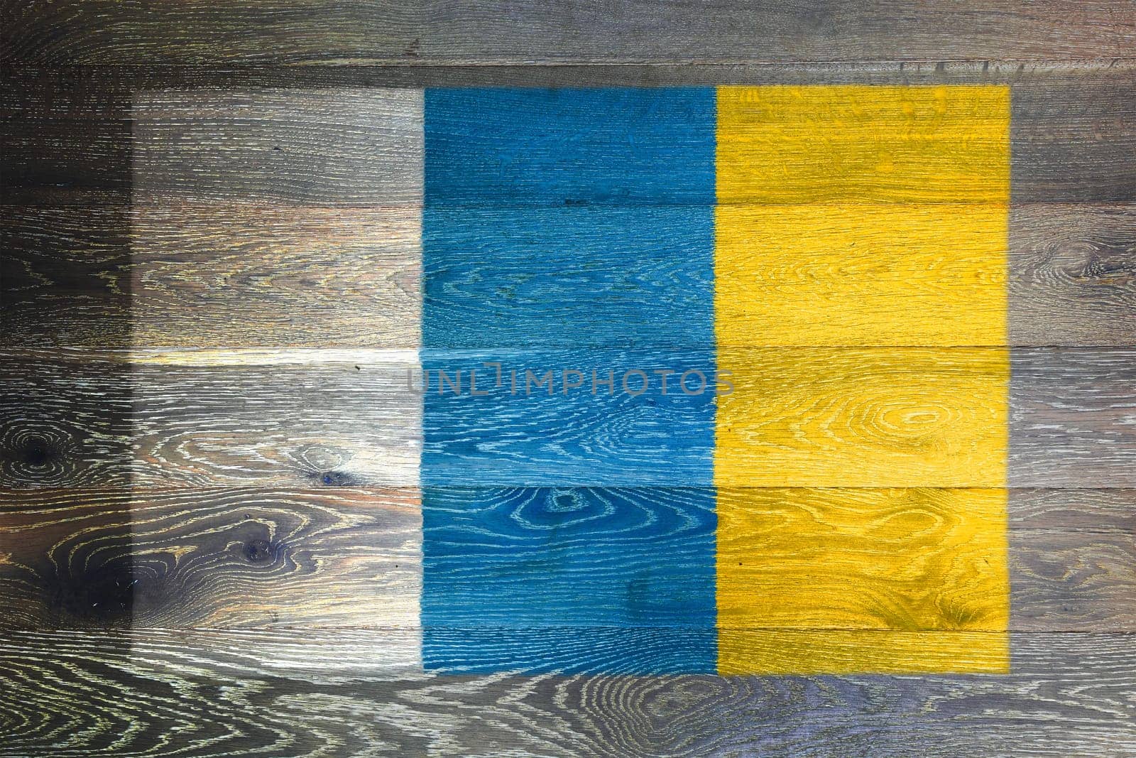 A Canary Islands flag on rustic old wood surface background