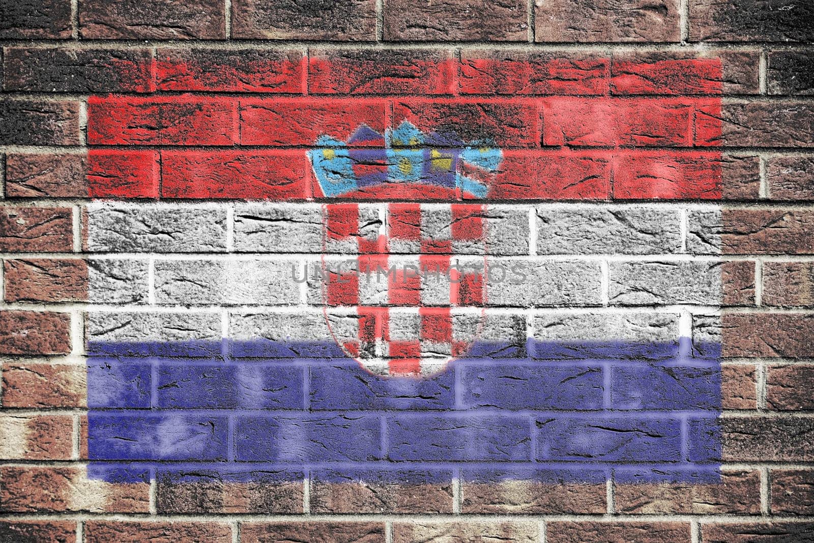 A Croatia flag on an old brick wall background