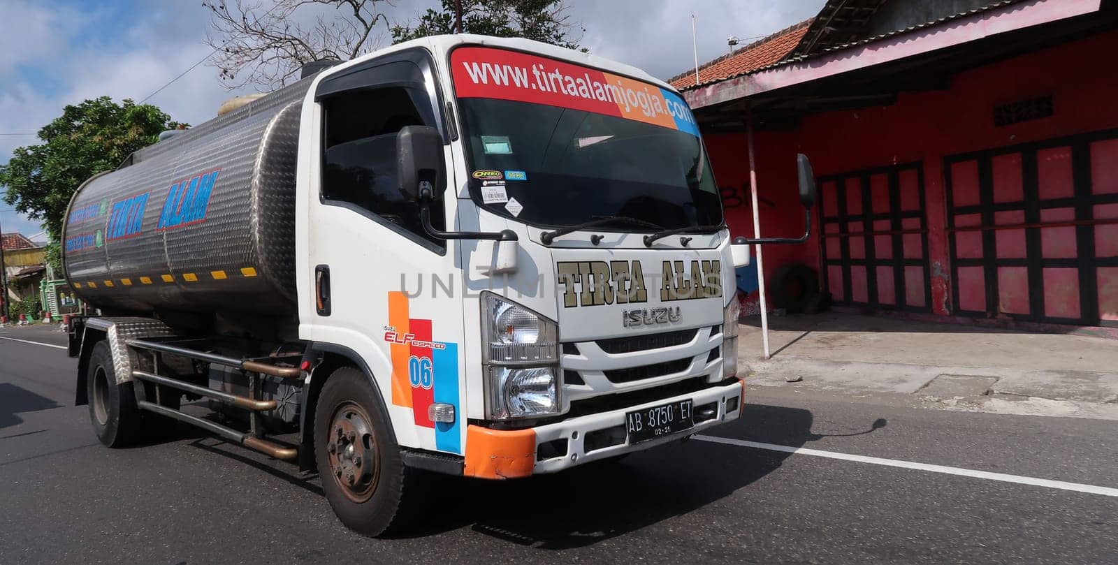 trucks making local commercial delivery at urban city and on the city streets in asia logistical transport system in Indonesia