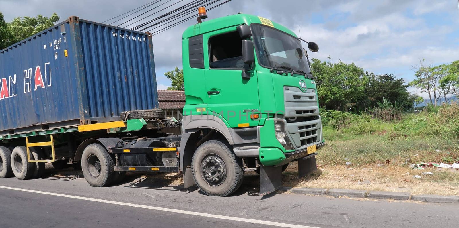 trucks making local commercial delivery at urban city and on the city streets in asia logistical transport system in Indonesia