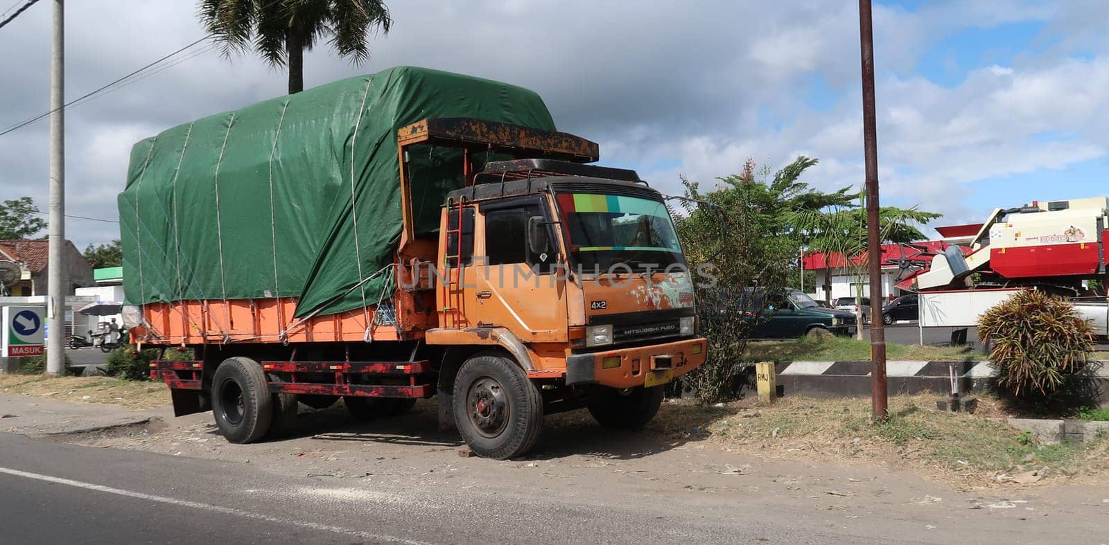 trucks making local commercial delivery at urban city and on the city streets in asia logistical transport system in Indonesia