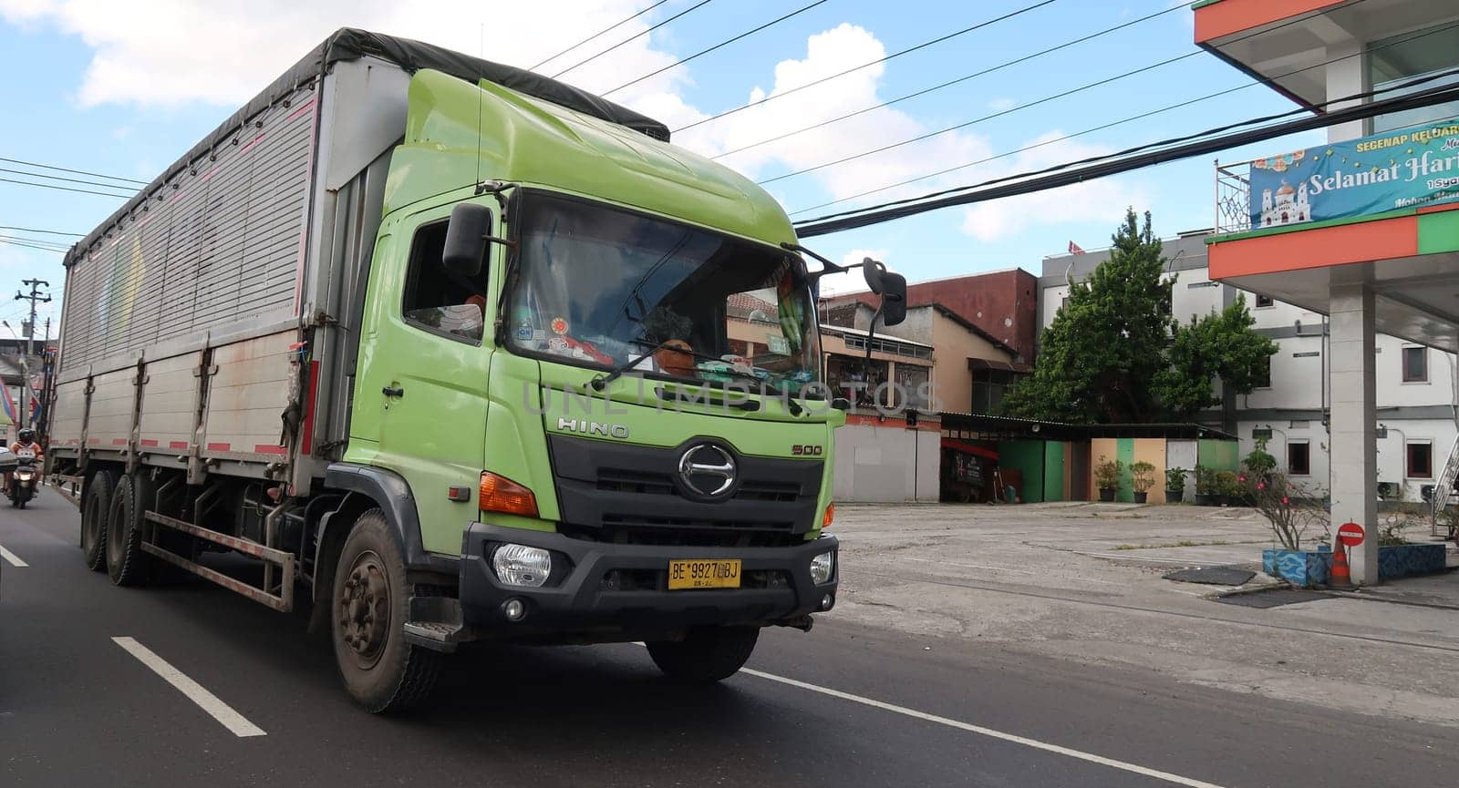 trucks making local commercial delivery at urban city and on the city streets in asia logistical transport system in Indonesia