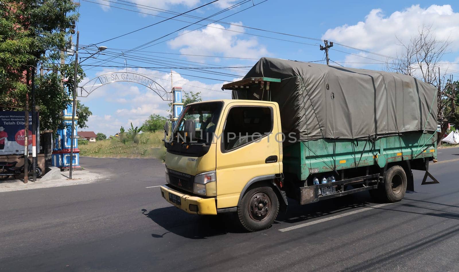 trucks making local commercial delivery at urban city and on the city streets in asia logistical transport system in Indonesia