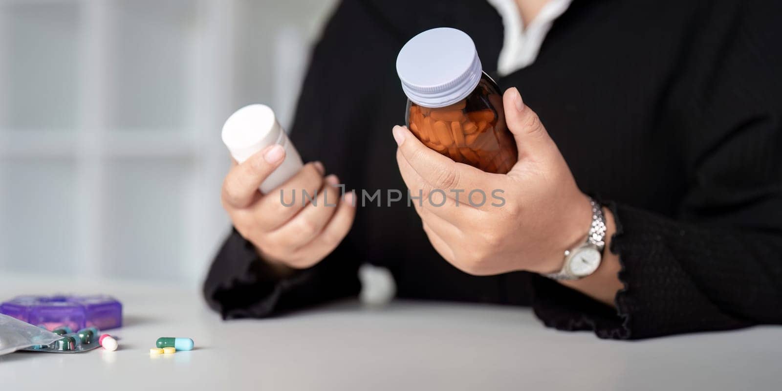 Close up woman holding pill in hand with water. Female take tablet from headache, painkiller, Healthcare, medicine, treatment. therapy concept.