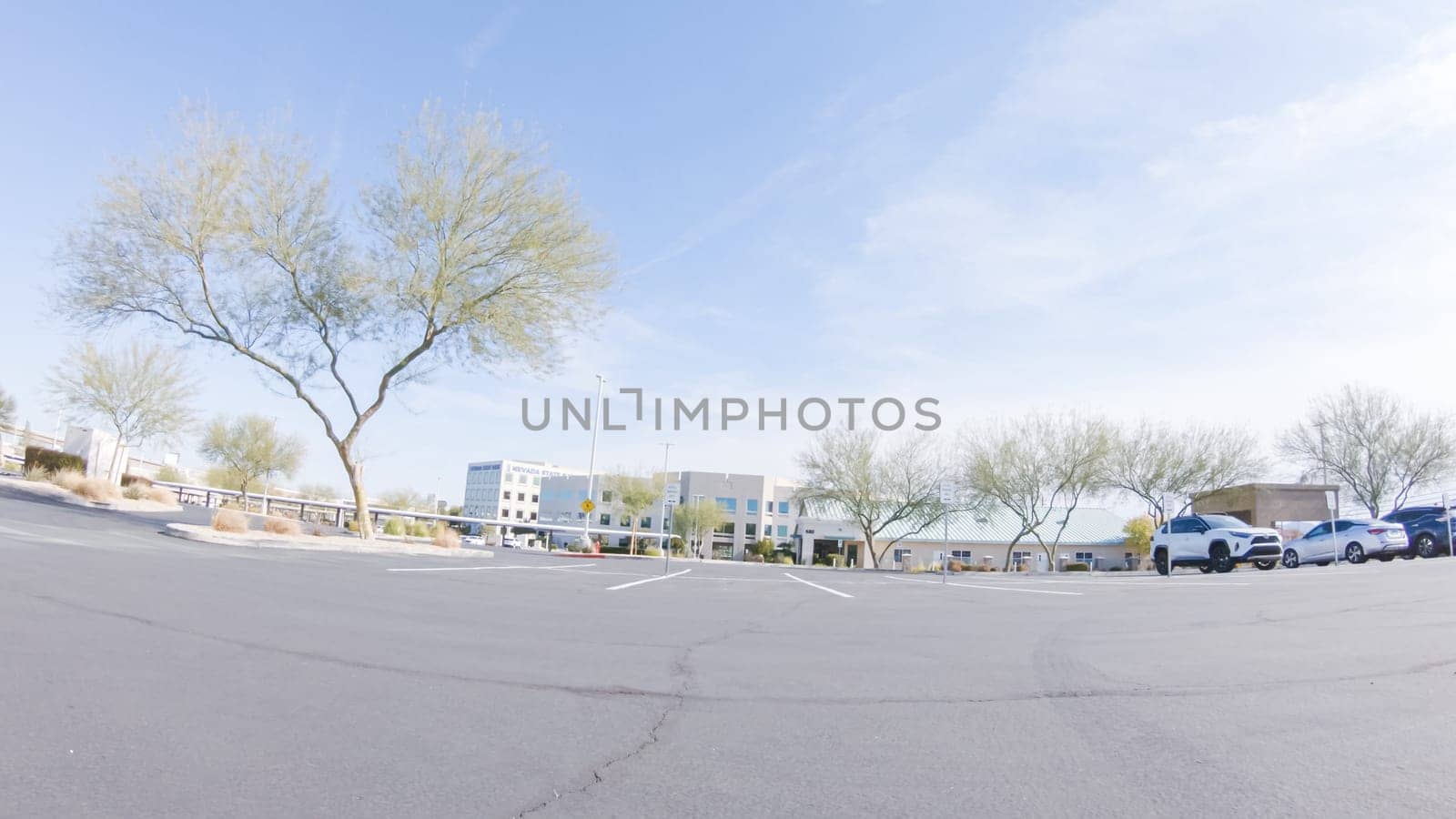 Driving through a bustling Las Vegas residential neighborhood during the day reveals the vibrant energy and unique architectural styles that make the city's communities so captivating.