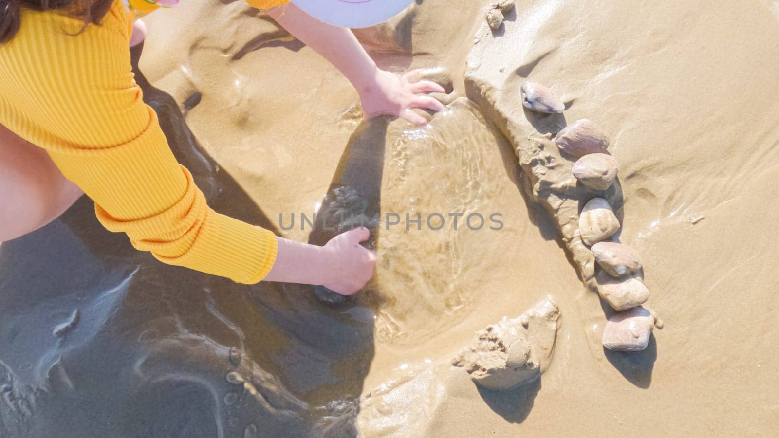 Little girl winter clamming at Pismo Beach by arinahabich