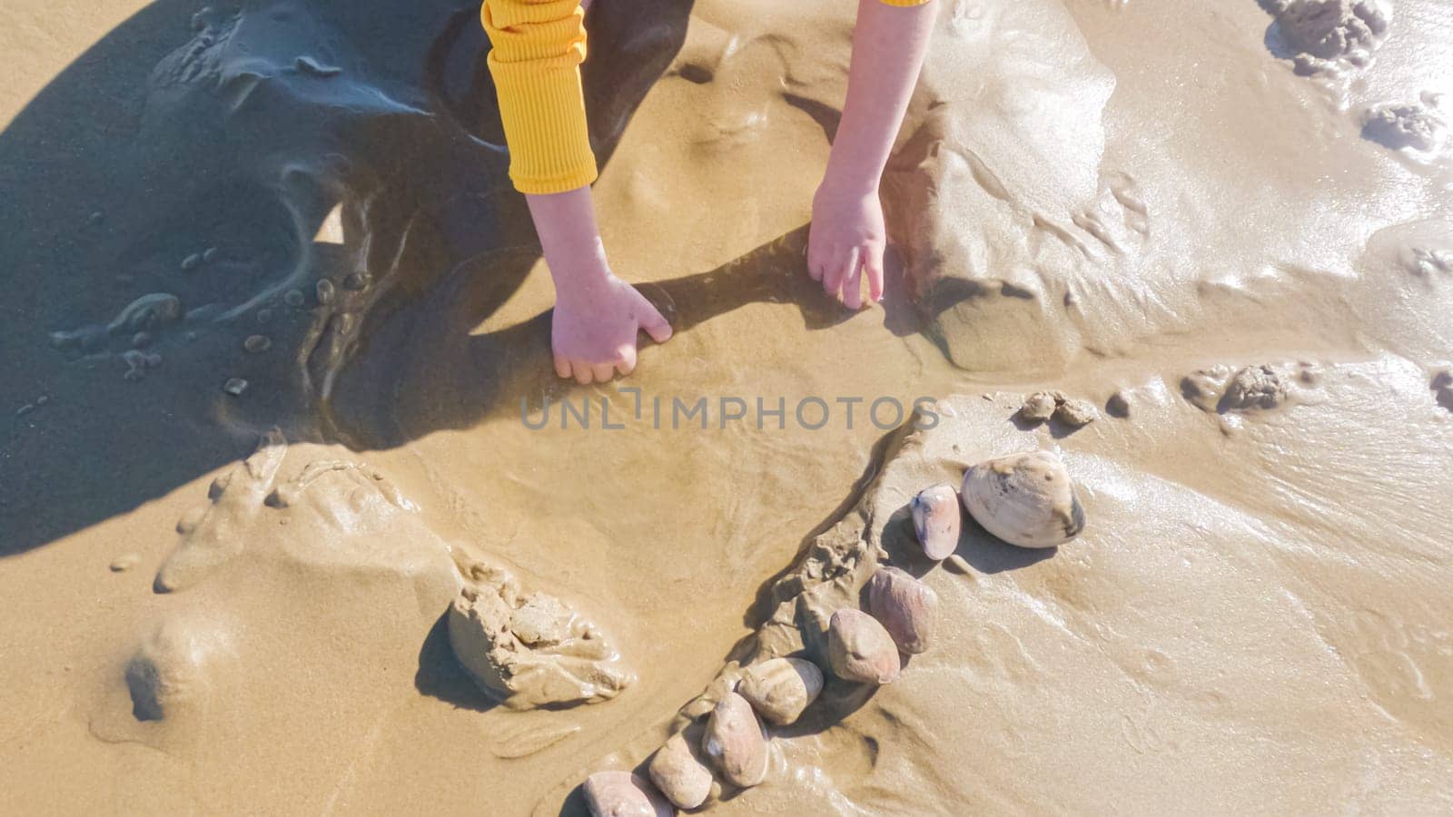 Little girl winter clamming at Pismo Beach by arinahabich