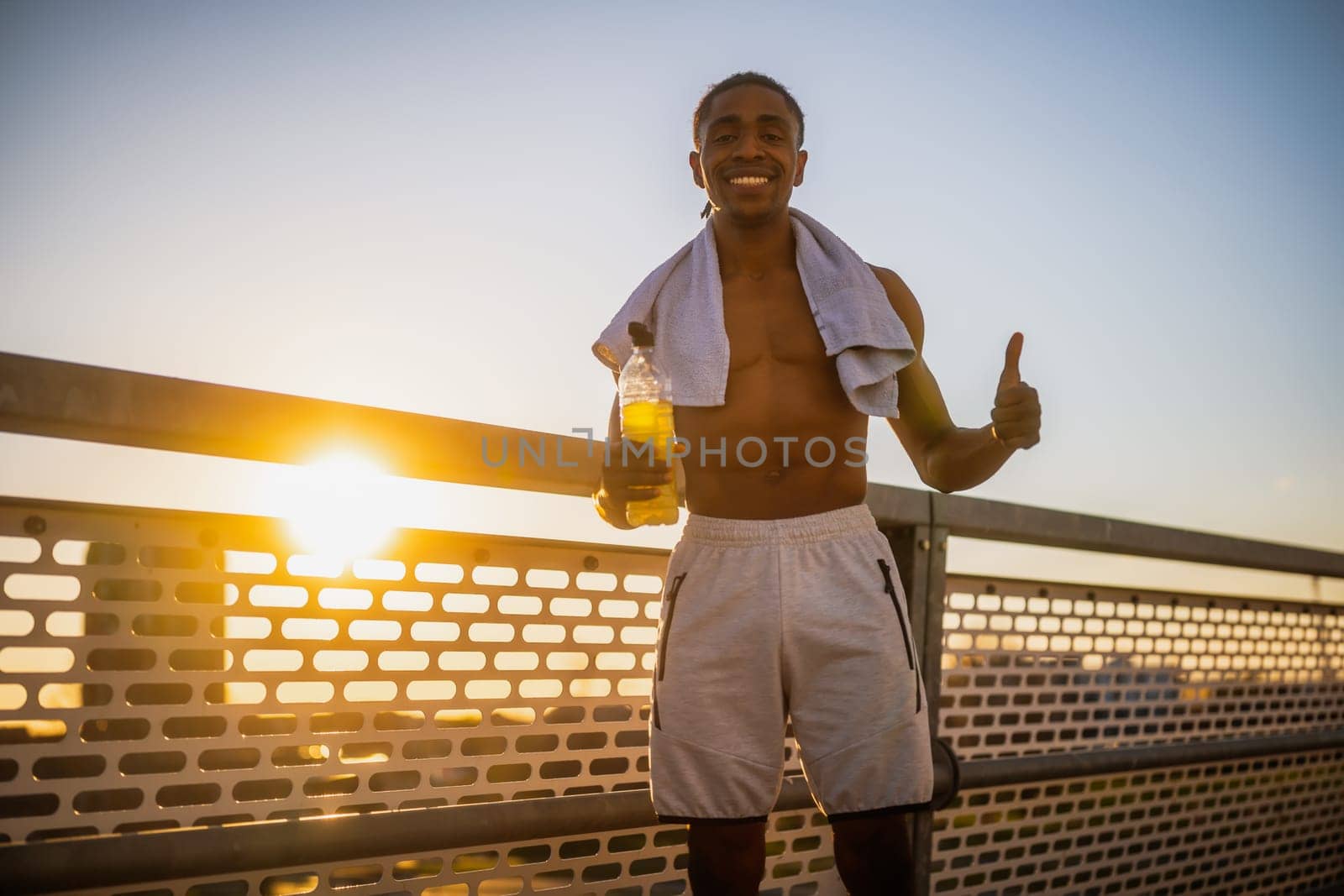 Portrait of young happy  man who is ready for exercising and jogging.