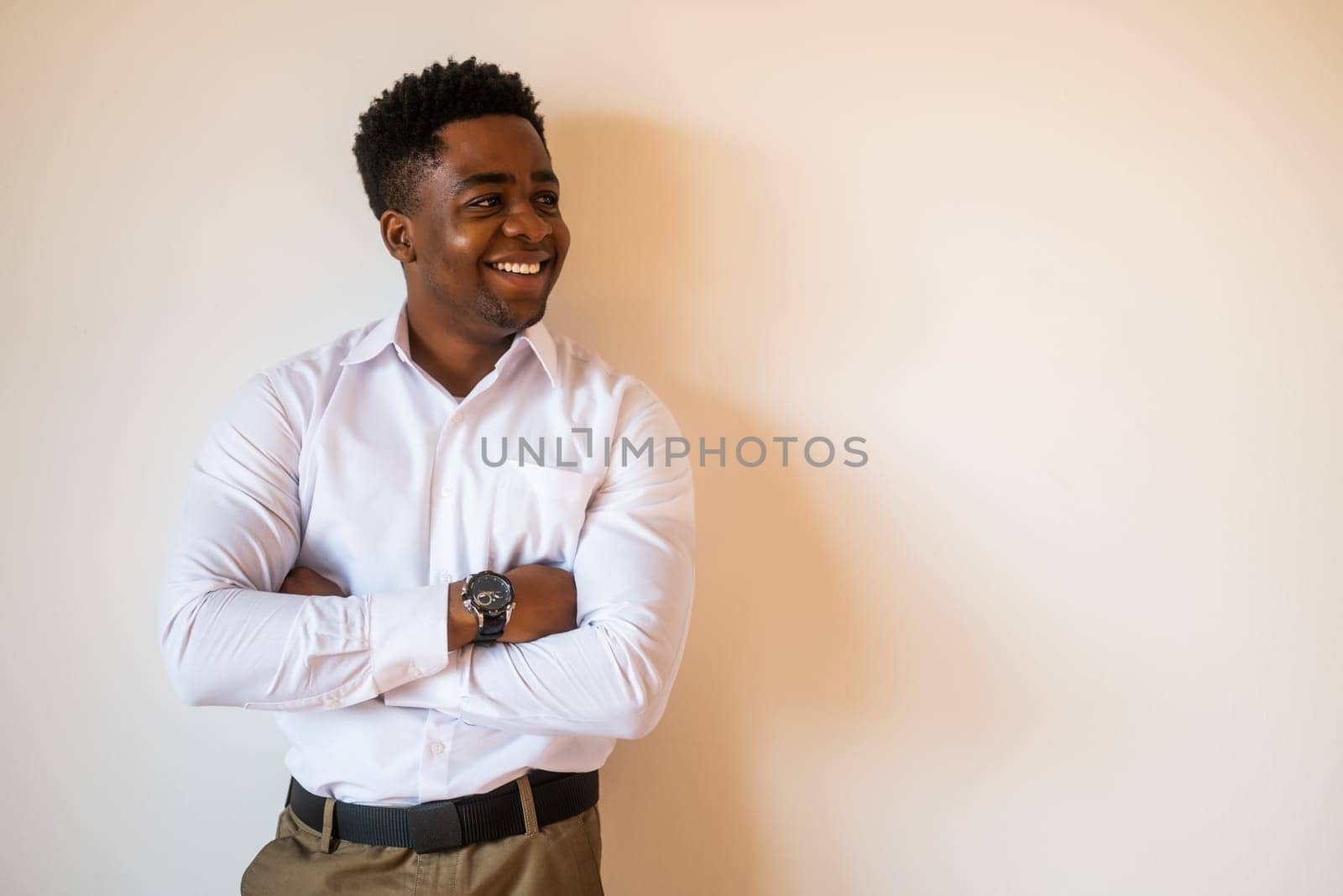 Portrait of happy man who is smiling and looking away. Copy space on image for your text or advert. by djoronimo