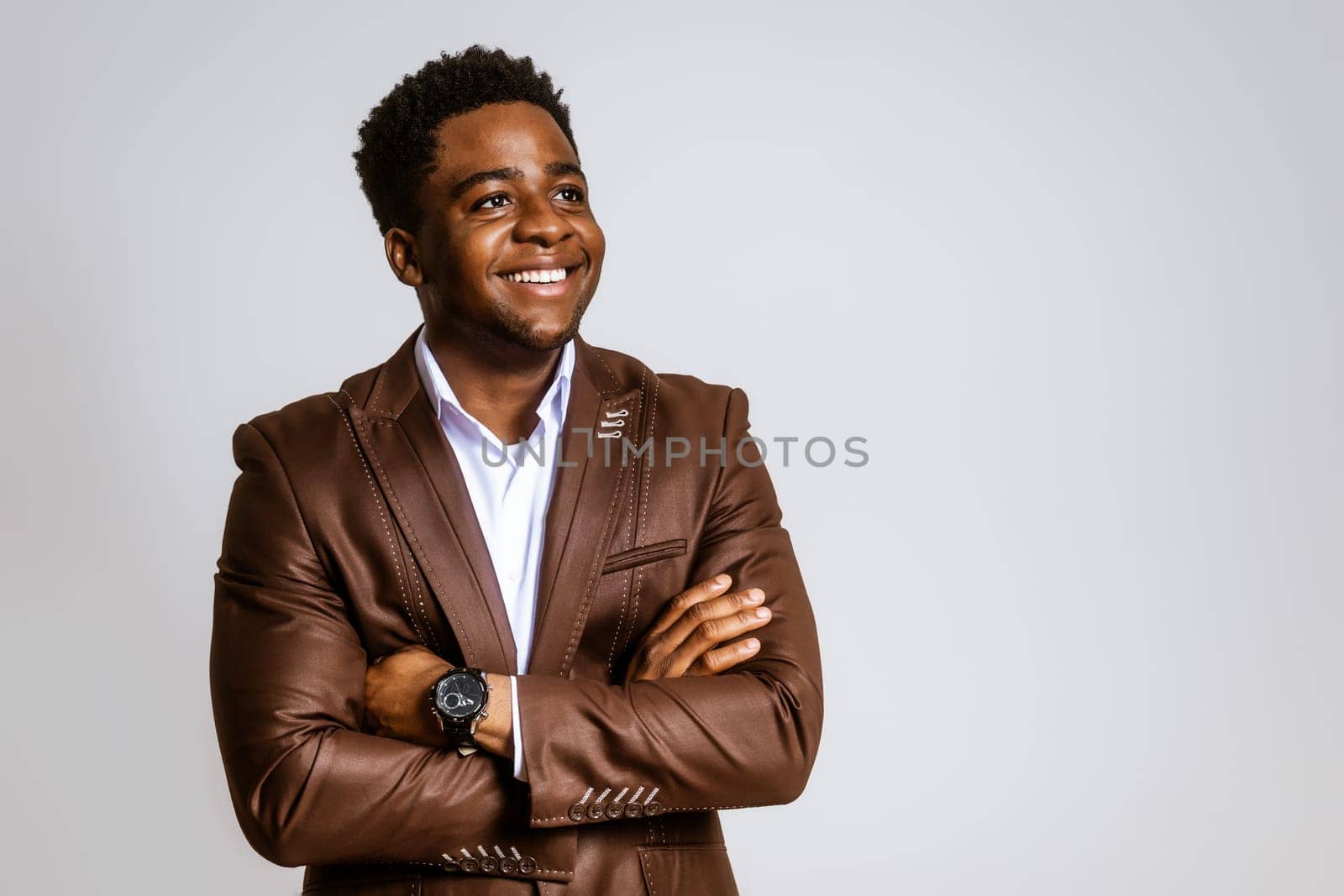 Portrait of happy businessman who is smiling and looking at camera. Copy space on image for your text or advert.