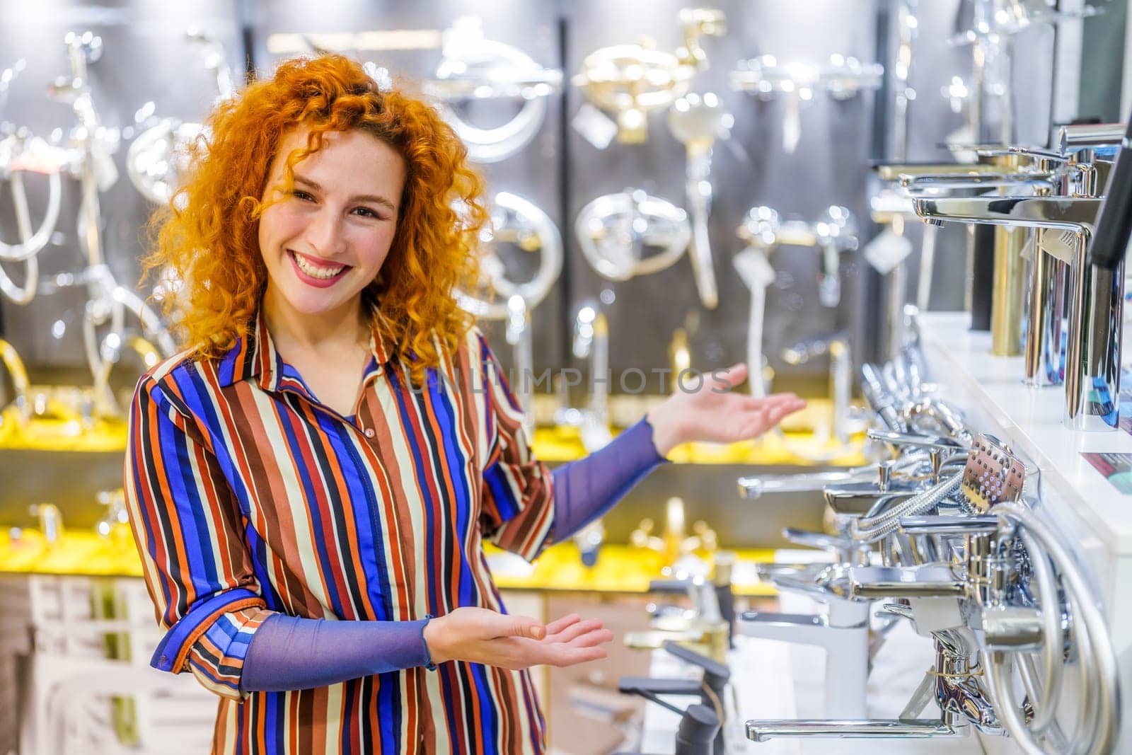 Portrait of salesperson in bathroom store. Happy redhead woman works in bath store. Sales occupation.