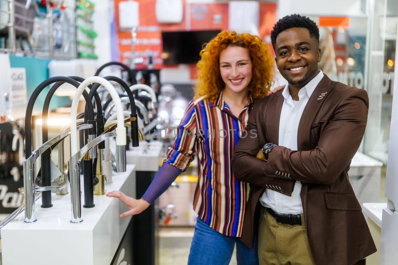 Portrait of young couple who owns small business bath store. Man and woman work in partnership.