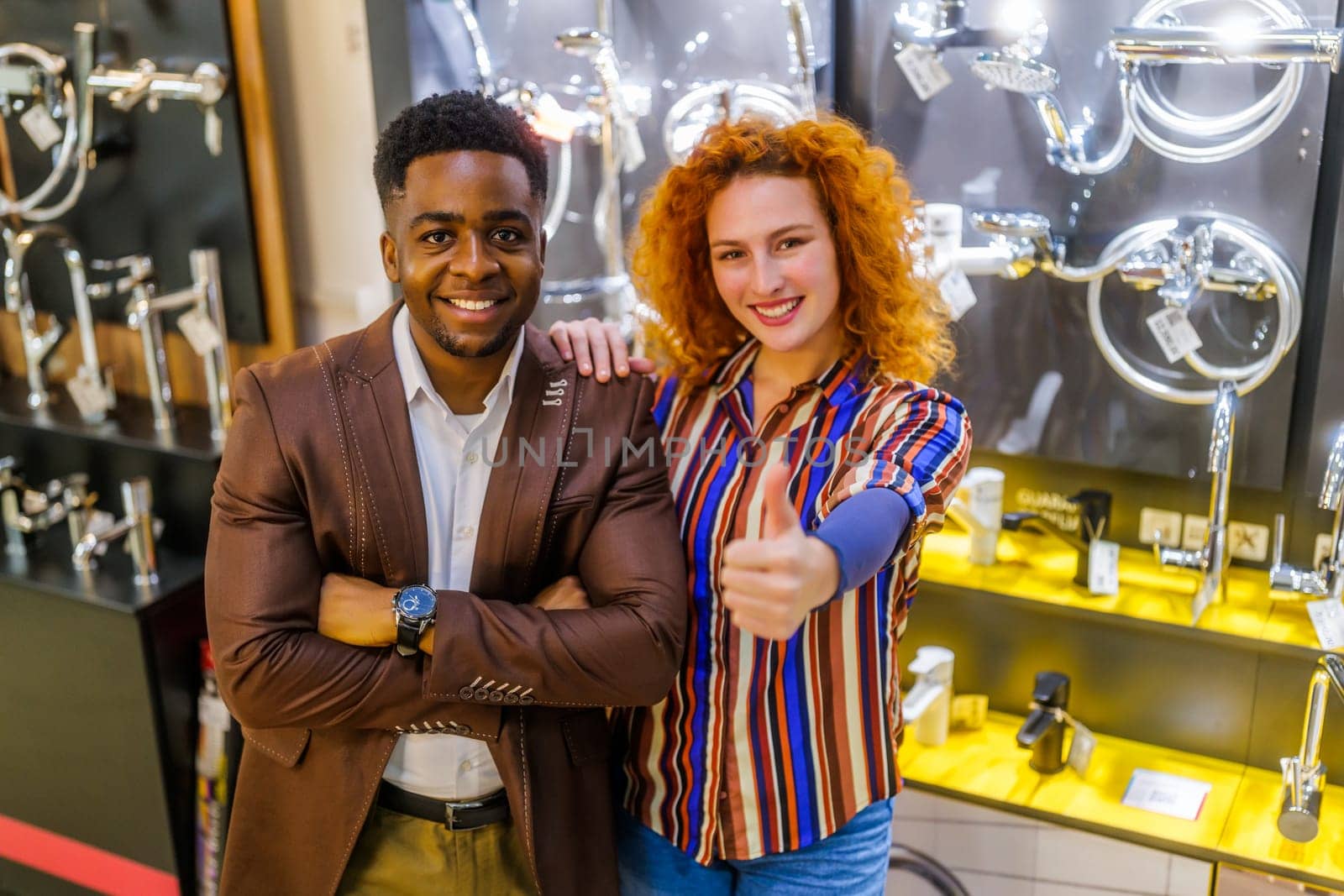 Portrait of young couple who owns small business bath store by djoronimo