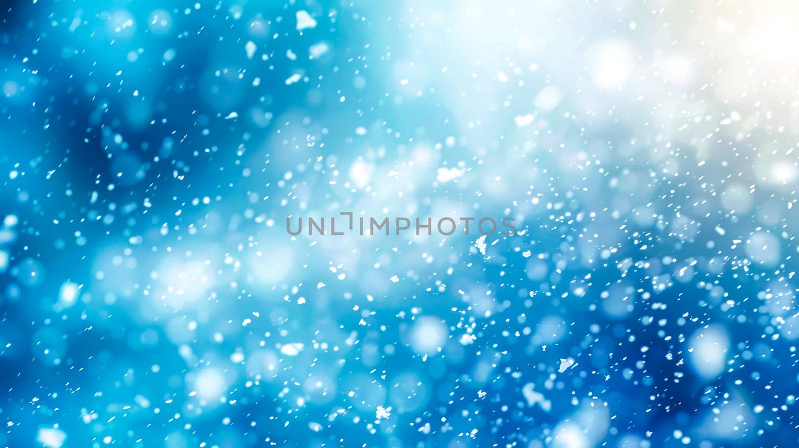 Winter wonderland background with snowflakes, bokeh lights, and abstract blue soft focus, creating a tranquil and magical effect for the festive holiday season