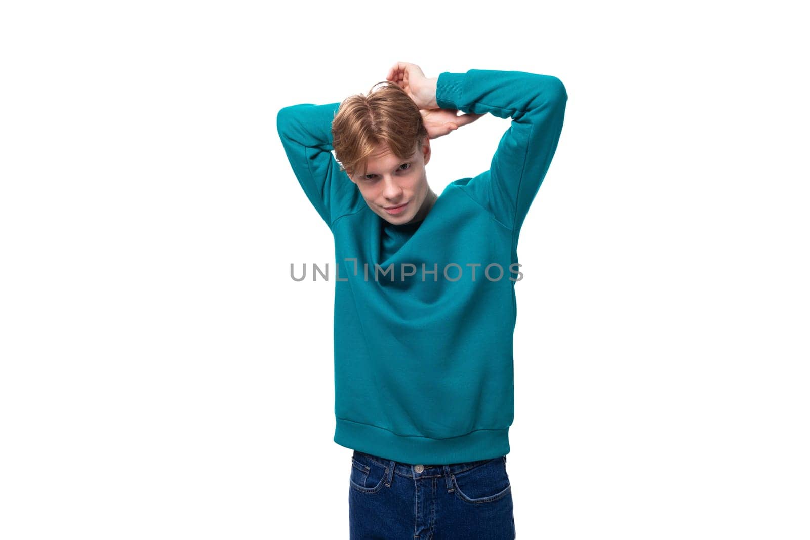 young authentic handsome man with red hair wearing a blue sweater by TRMK