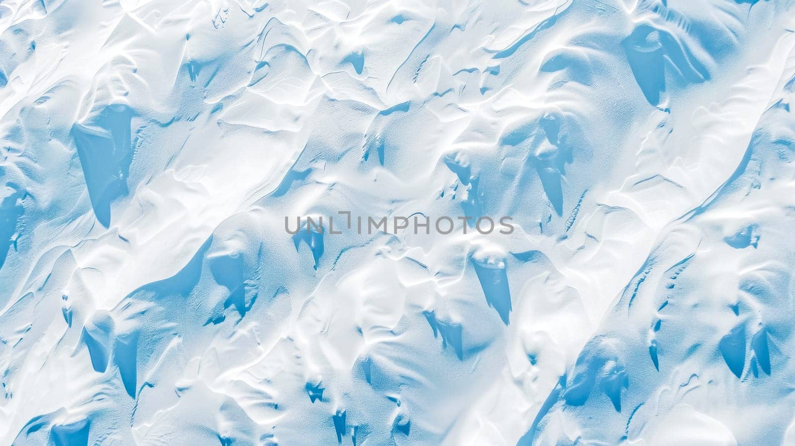 Aerial view of a serene, untouched snowy landscape bathed in a gentle glow