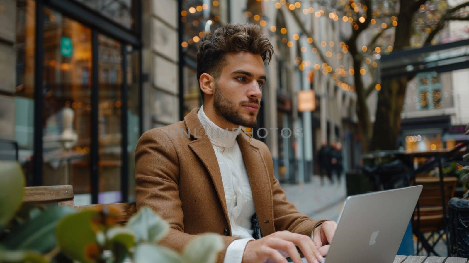 A man sitting at a table with his laptop open, AI by starush