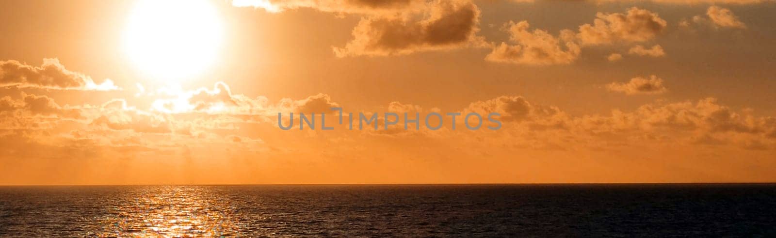 horizontal sea panorama in brown tone, the sun is reflected in the water by Annado
