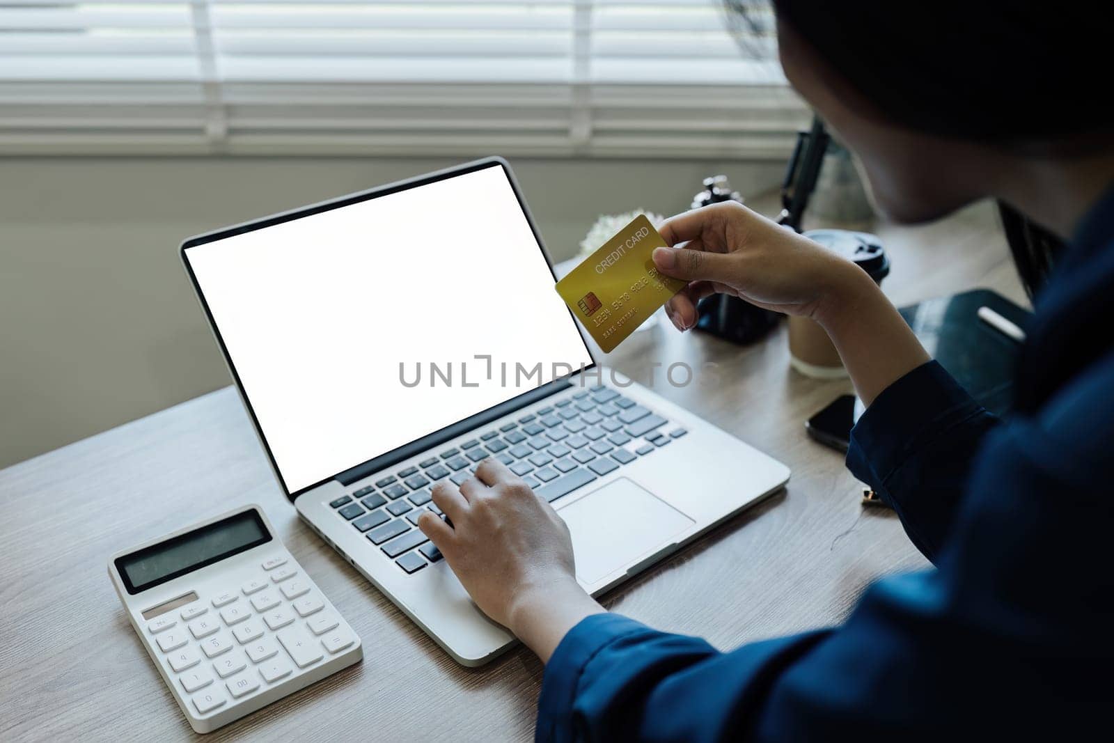 Woman make purchase on Internet, making online payment credit card on laptop.