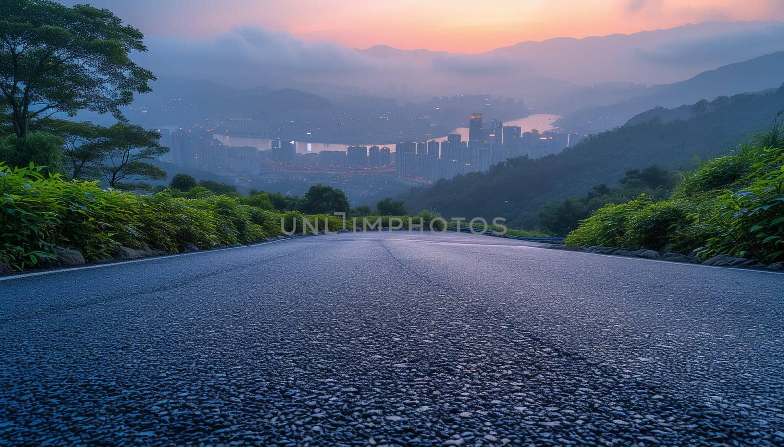 The perspective of the road against the background of sunset and the cityscape. High quality photo