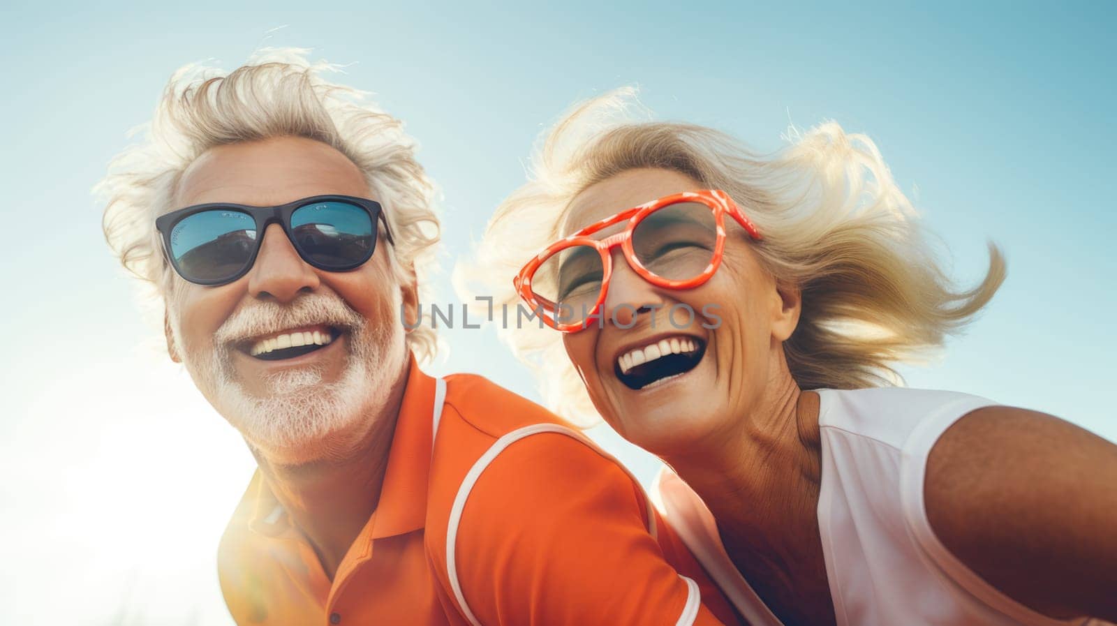 Happy elderly couple in smiling on sunny day, enjoying life after retirement together.