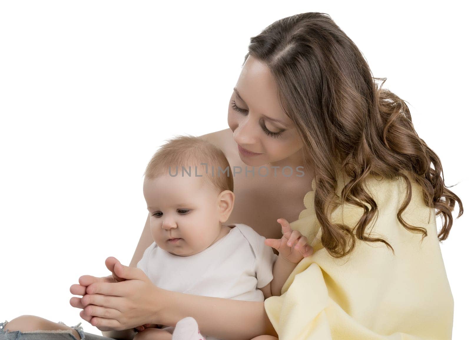 Loving mother playing with her little daughter, isolated on white