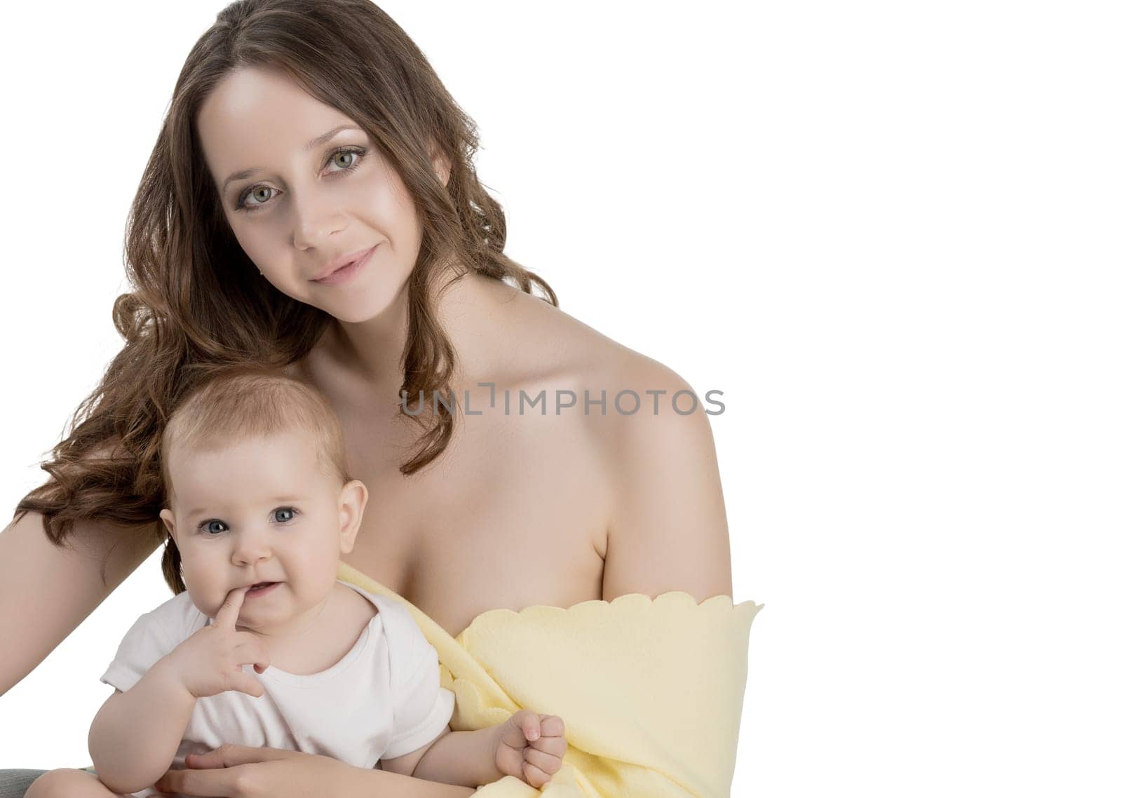 Studio portrait of pretty woman and her adorable child