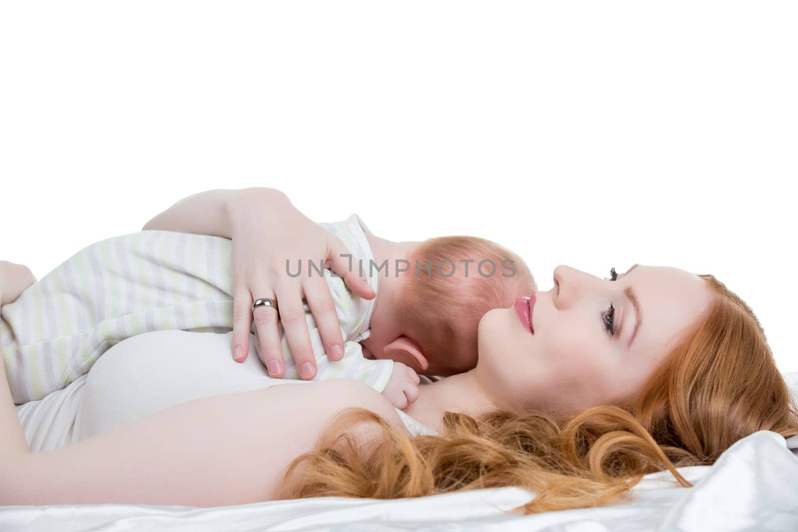 Image of loving mother put her little child to breast
