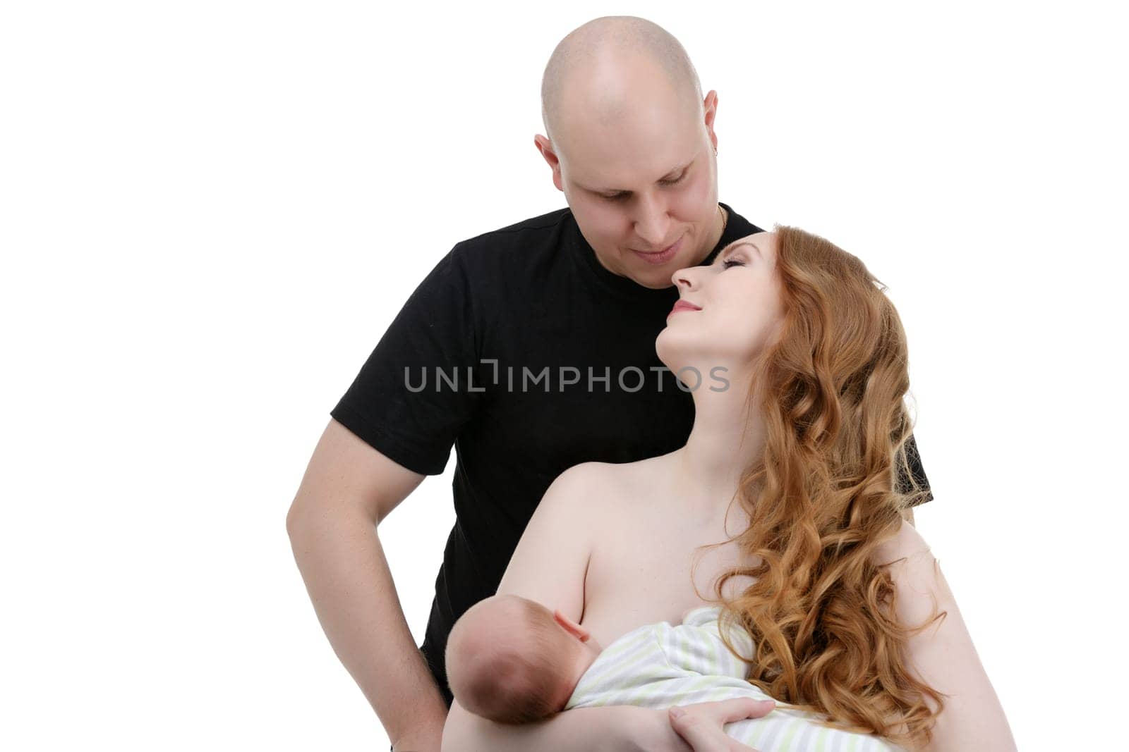 Studio portrait of happy family who recently had baby