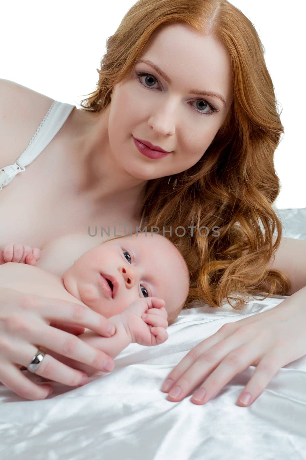 Portrait of pretty mother and her baby, isolated on white