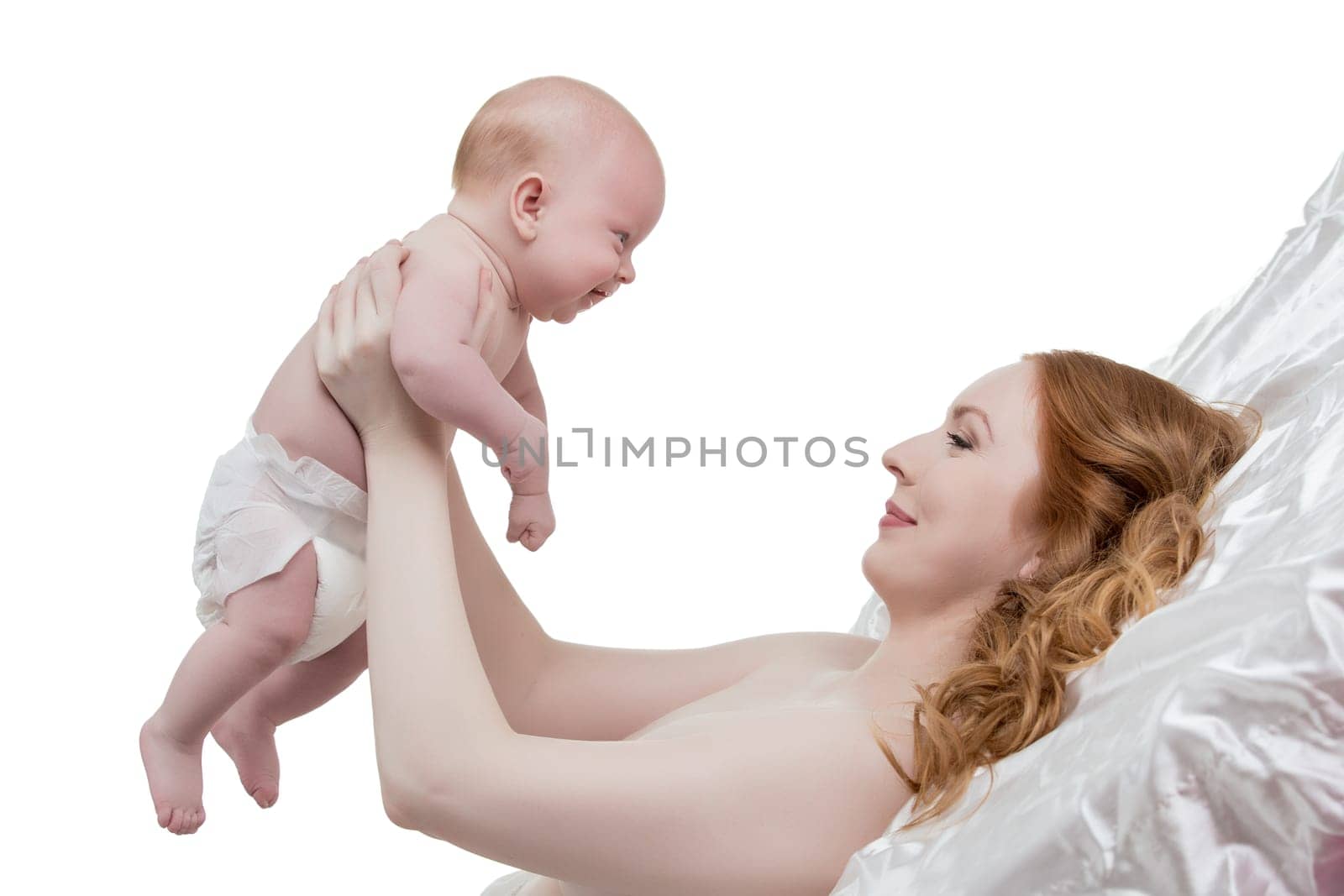 Studio photo of mother admiring her adorable little son