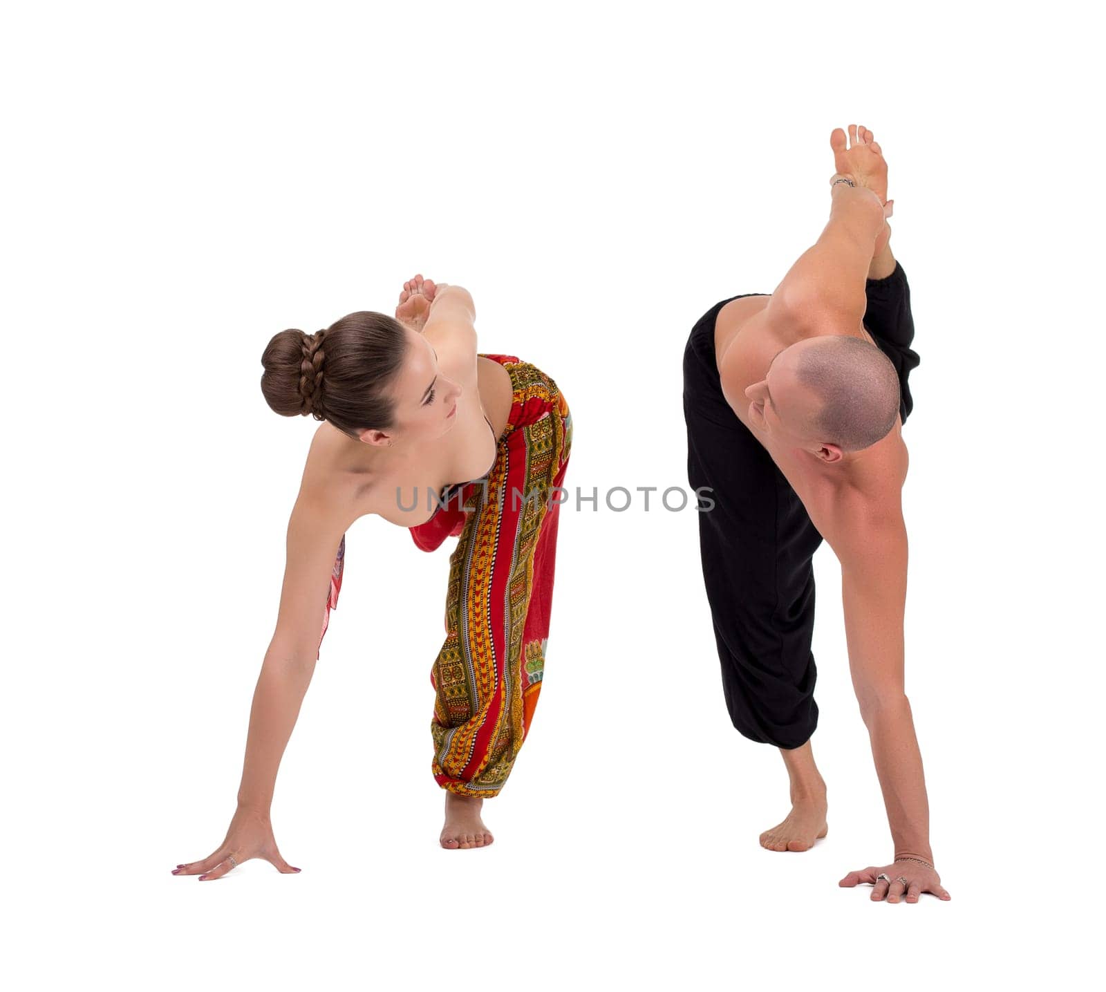 Paired yoga. Man and woman look at each other during exercise