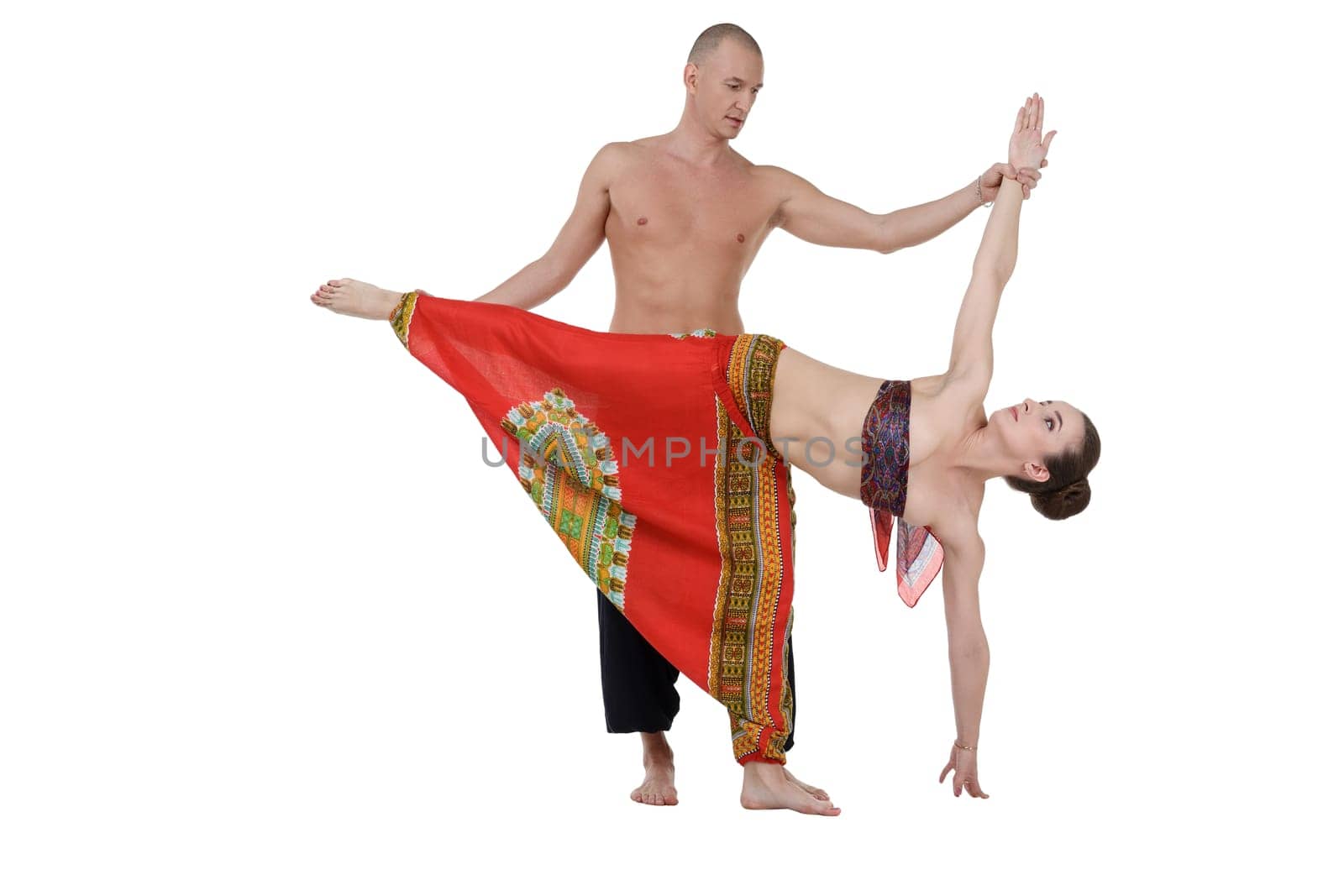 Yoga. Middle-aged man and woman training by rivertime