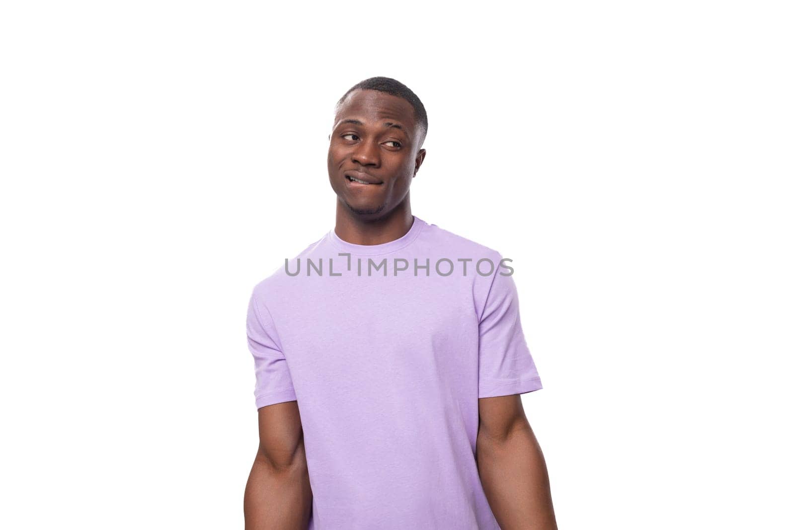 young charismatic 30 year old american man dressed in corporate lilac cotton t-shirt with print mockup.