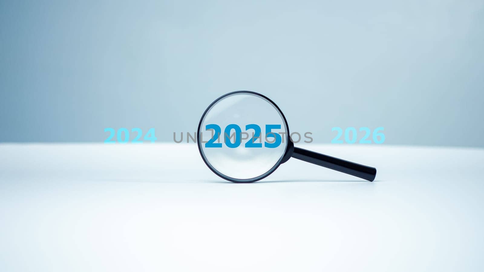 Magnifying glass and text 2025 new year idea concept, 2025 inside of Magnifier glass on white background for focus current situation, Black magnifier glass with 2025 year among 2024 and 2026 for focus by Unimages2527