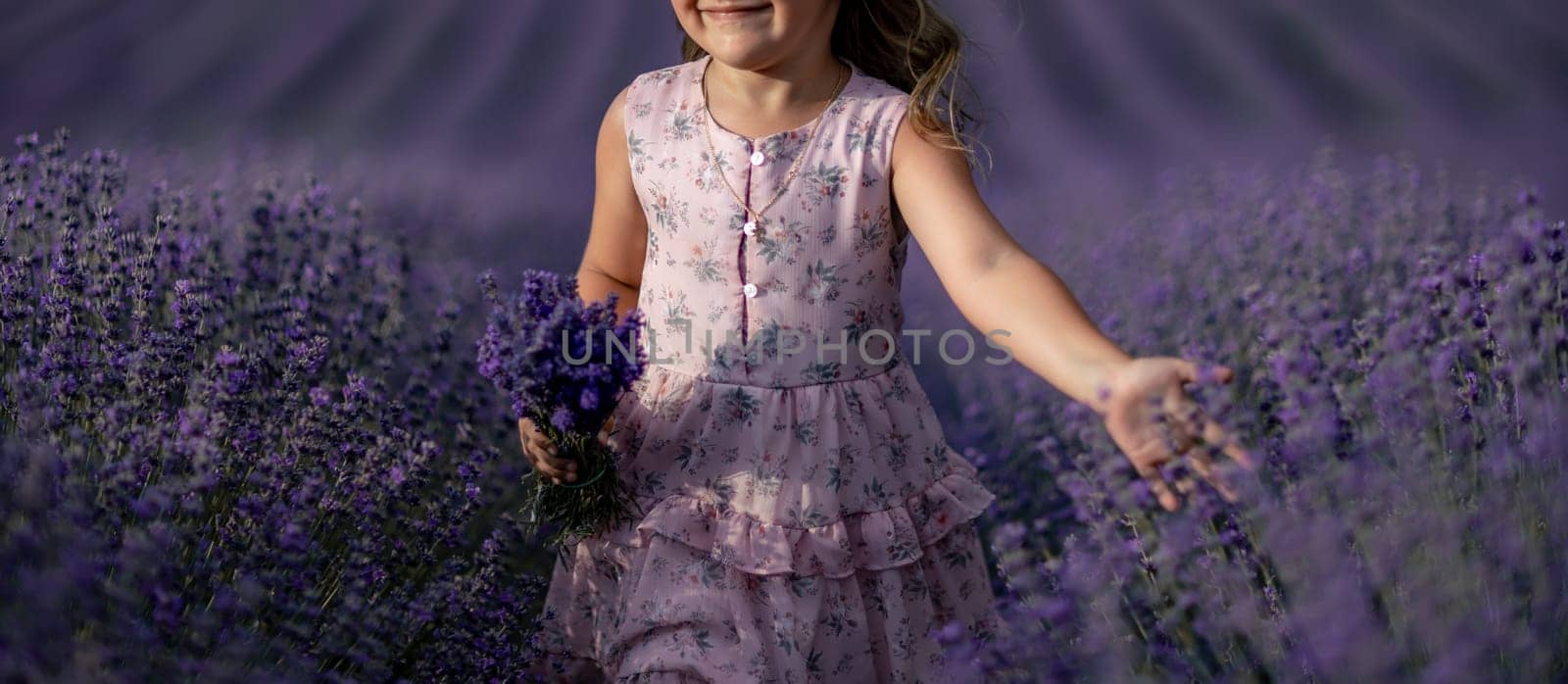 Lavender field girl. happy girl in pink dress in a lilac field of lavender. Aromatherapy concept, lavender oil, photo session in lavender by Matiunina