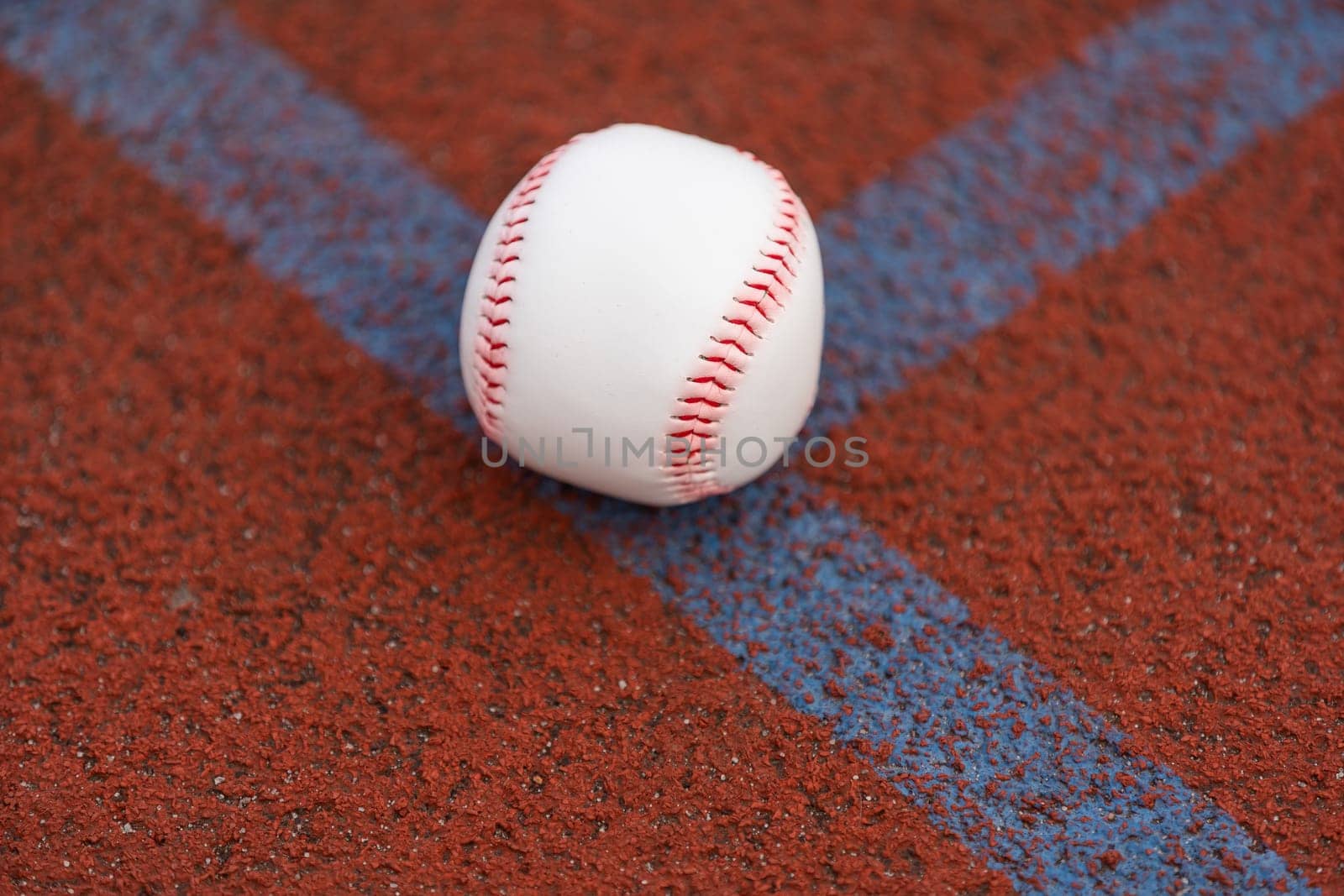 one baseball on infield of sport field. High quality photo