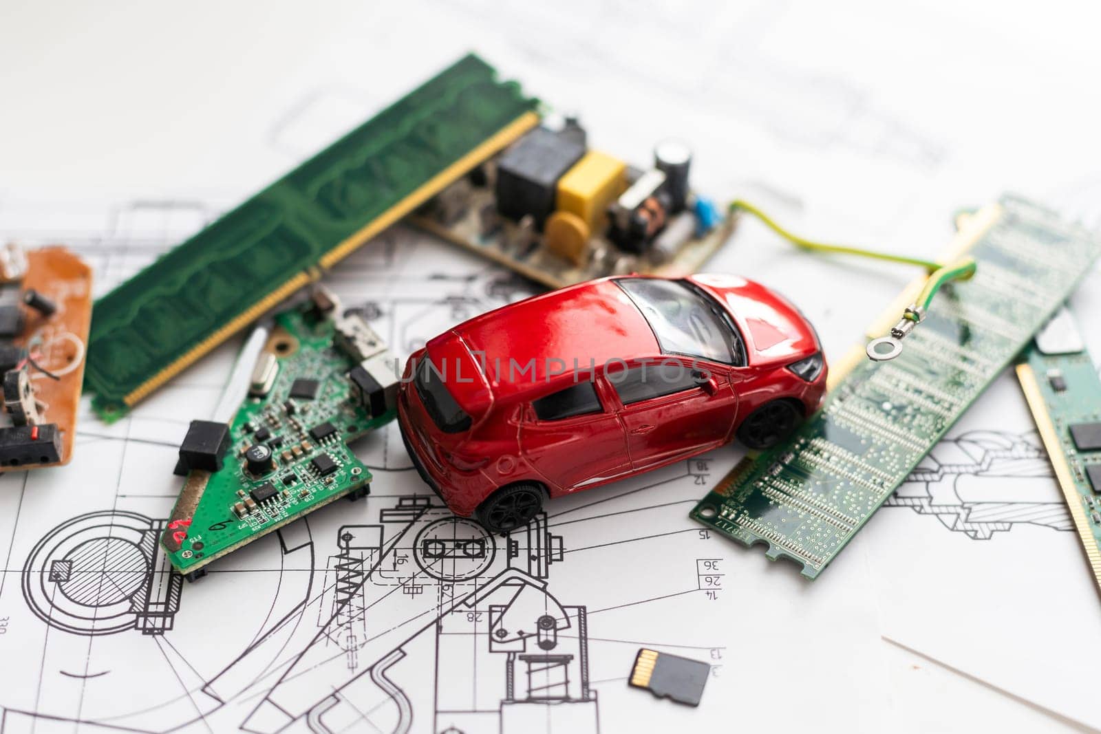 Electronic circuit board close up with car toy by Andelov13