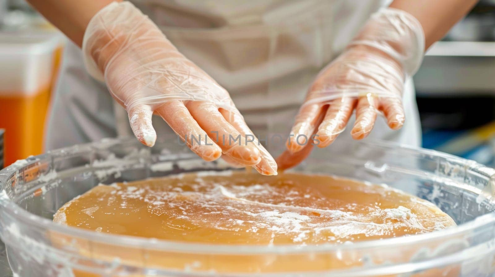 A person in white gloves is preparing food for consumption