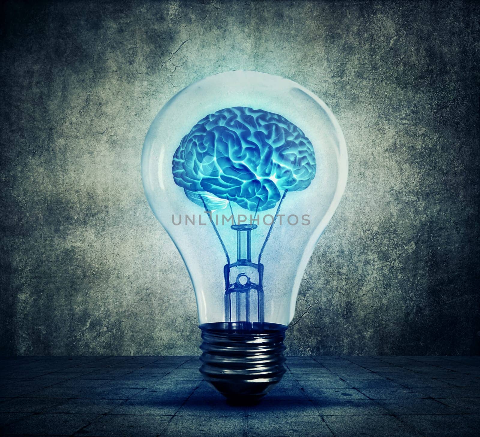  Human brain glowing inside a light bulb. Blue shining lamp on gray background. Emergence of the idea, Eureka creativity concept