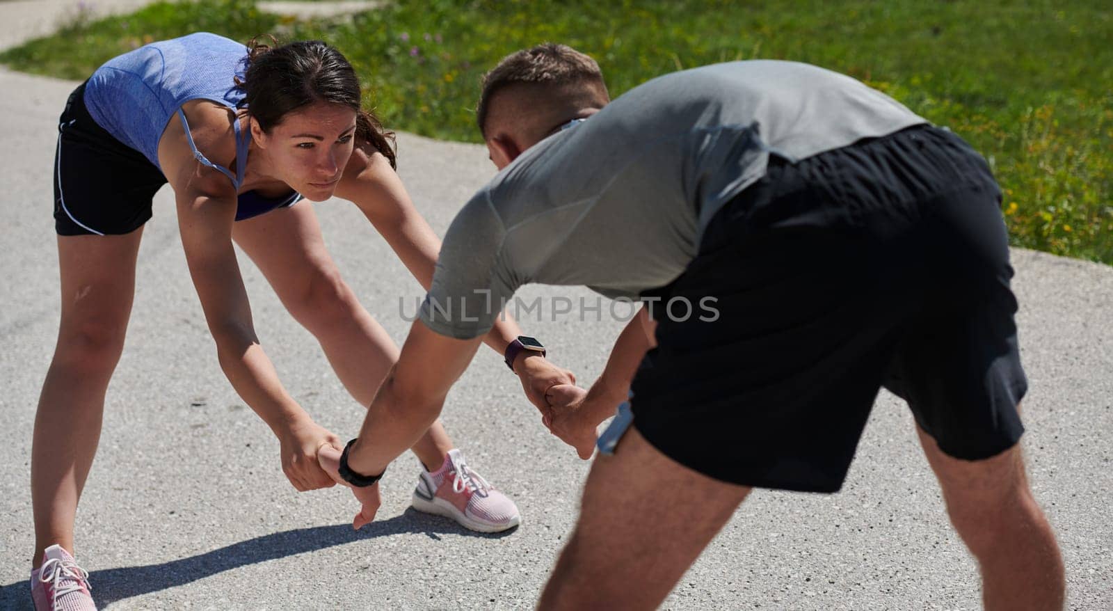 Exercise, mockup and couple workout and stretch together outdoors in nature by a mountain for health, wellness and fitness. People, partners and athletes training and keeping fit and heathy.