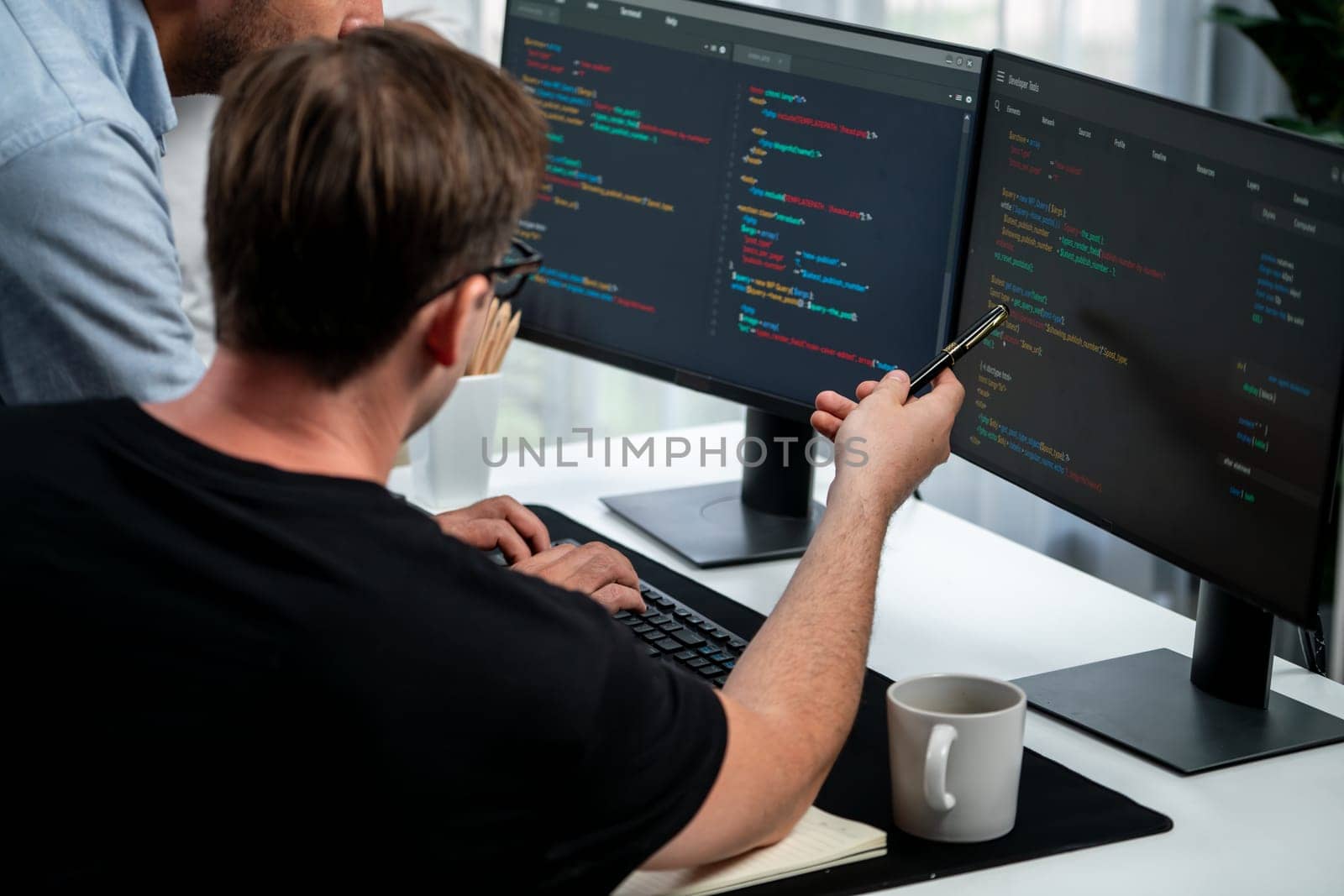 IT developers discussing online software development information on pc screen, creating program coding for latest version application on website. Concept of brainstorming firmware updated. Sellable.