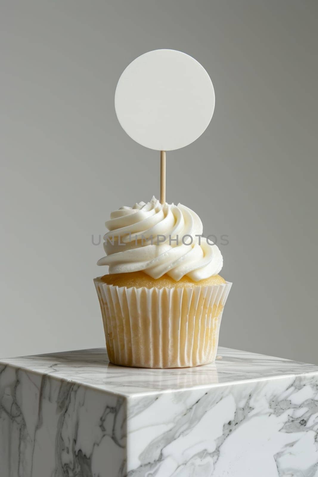Cupcake with white cream and an inscription plate on a white background by Lobachad