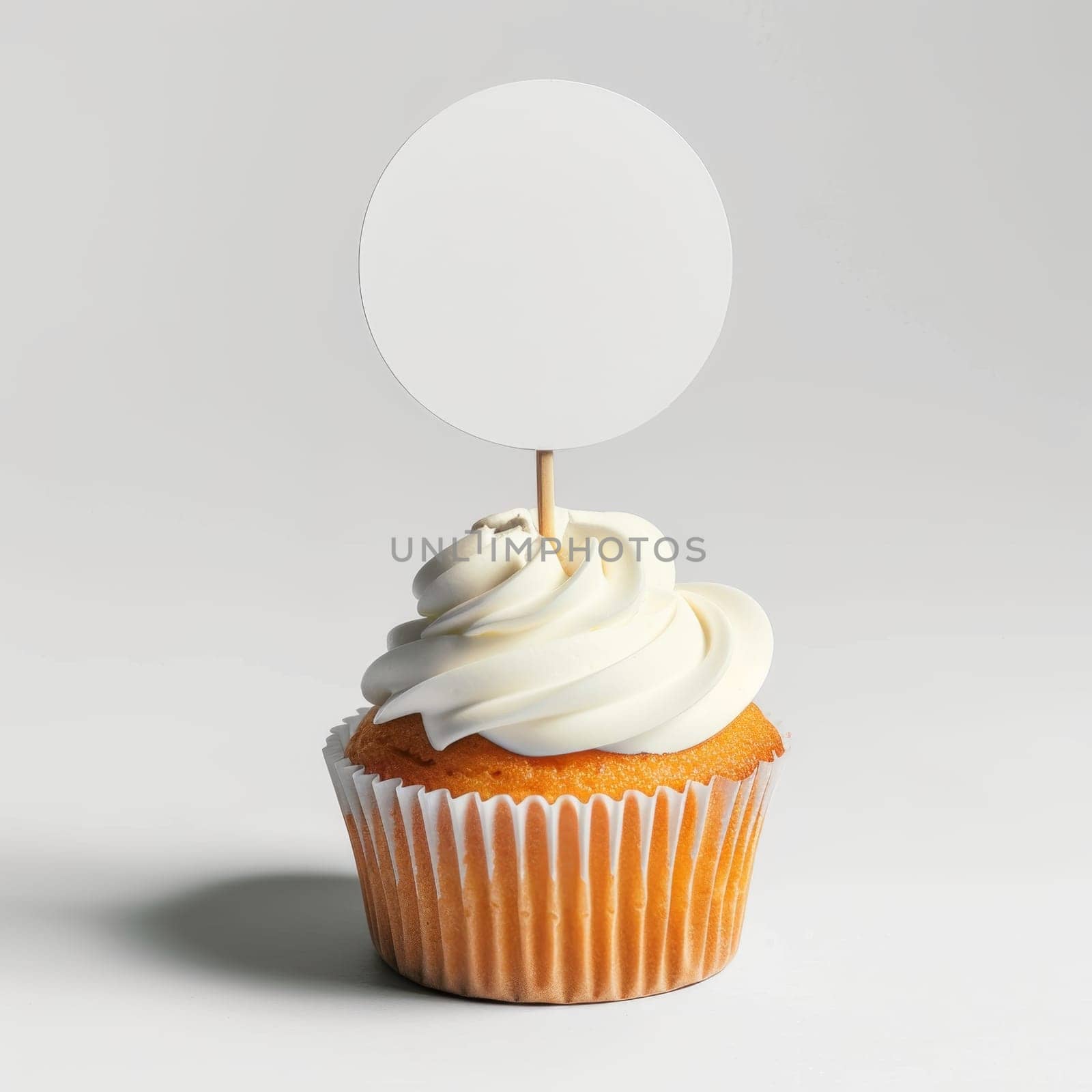Cupcake with white cream and an inscription plate on a white background by Lobachad