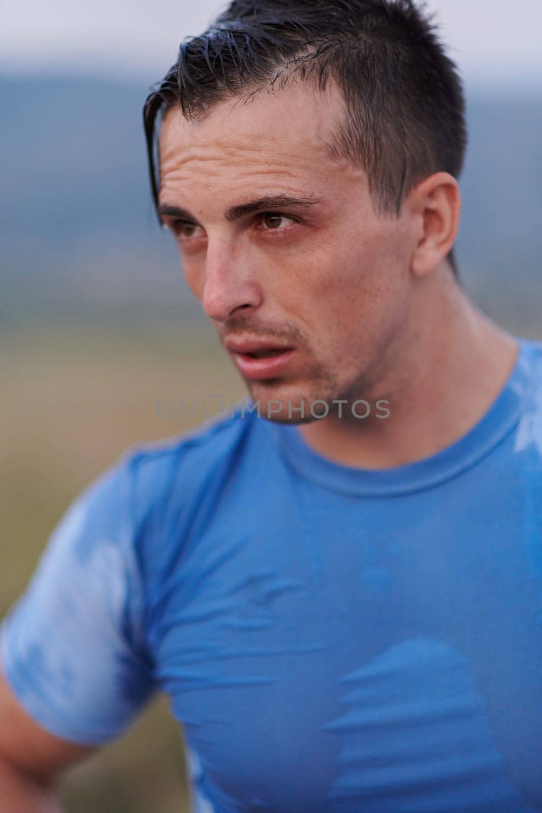 Post-Run Repose: Sweaty Athlete Rests After Intense Daily Run. by dotshock