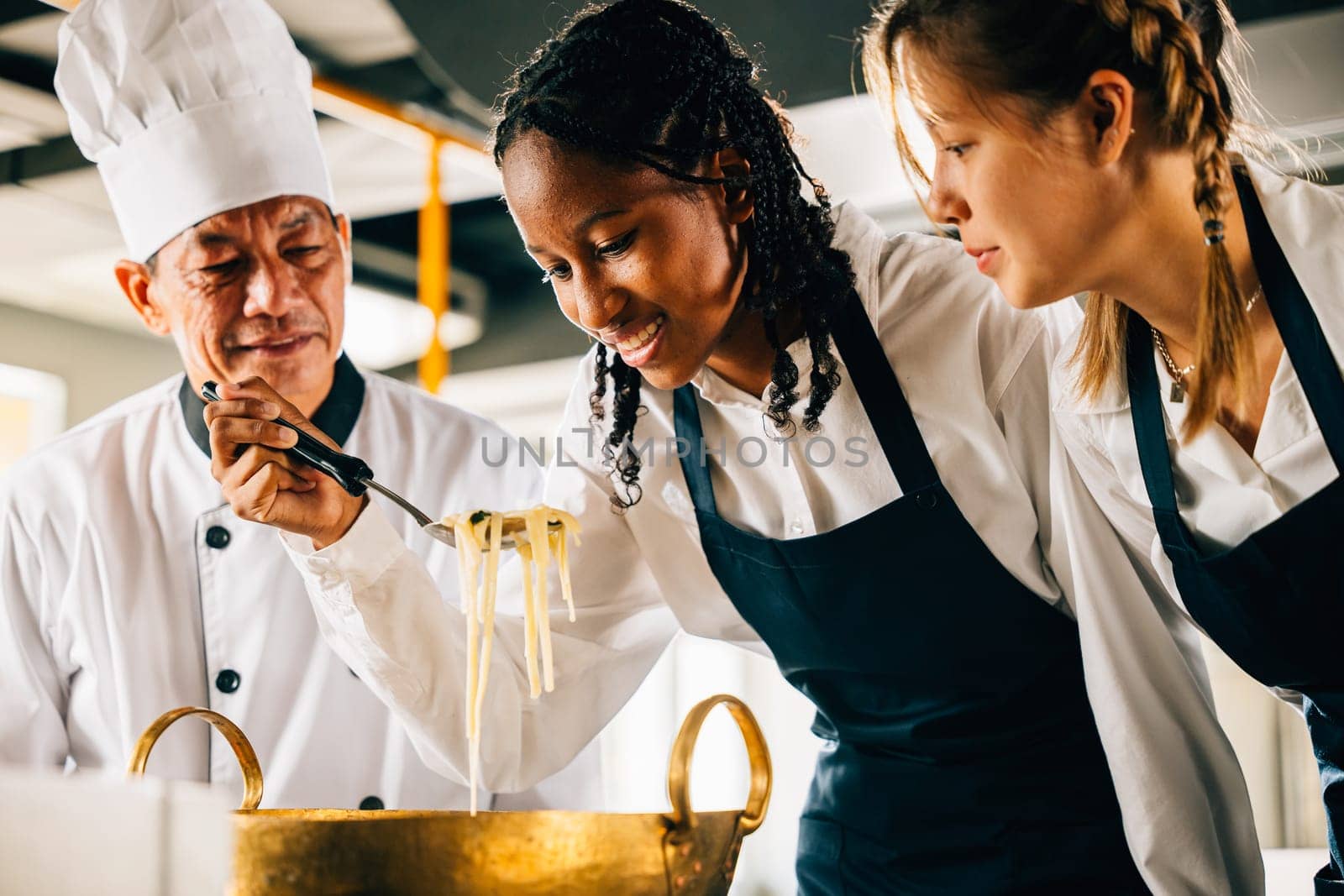 In kitchen chef teaches noodle cooking to students. Schoolgirls make ramen soup. Teacher guides kids at stove. Modern education in joyful dinner preparation. Foor Education Concept