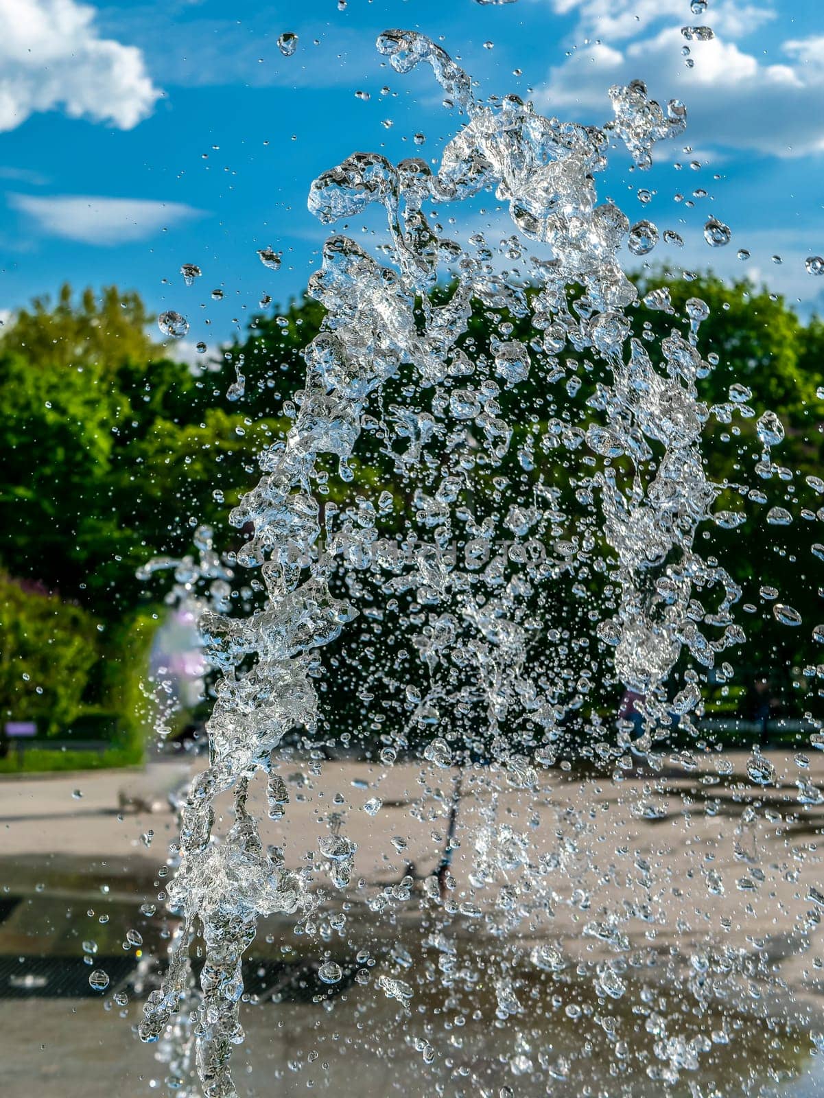 Fountain water jets working in a city park.