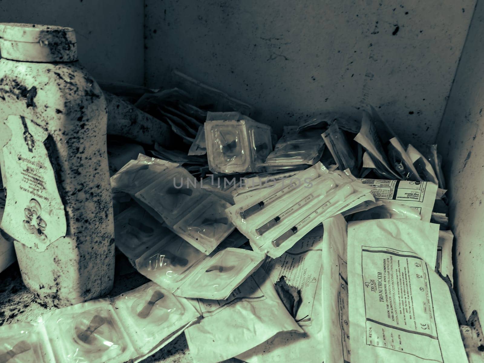 medical syringes on the ruins. black and white photo